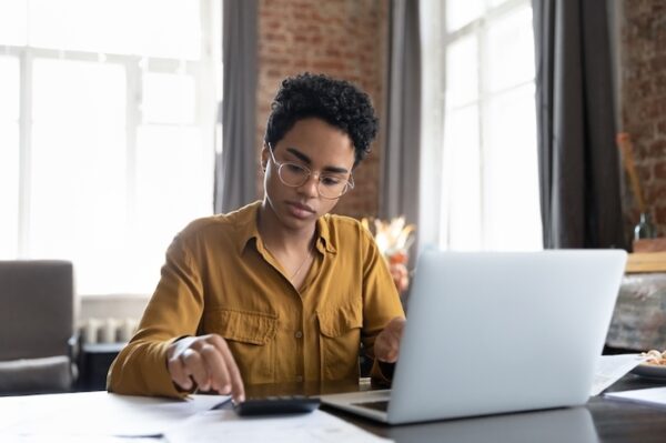 woman working in an office on a laptop