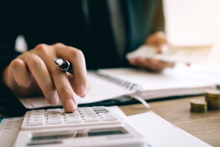 investors calculating on calculator