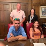 4 people posing for a photo