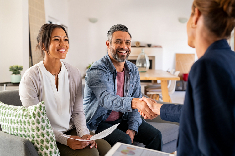 mature-indian-man-shaking-hands-with-realtor