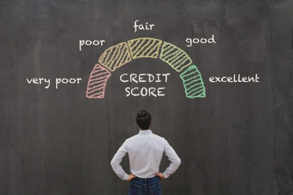 man looking up at credit score scale