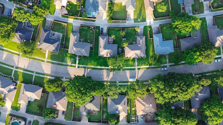 straight aerial view suburban houses parallel