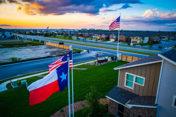 texas flag foreground american high background