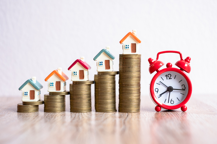 red alarm clock coin stack house models