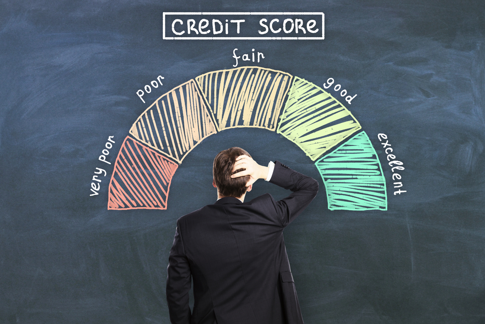 A man reviewing a credit score chart hoping to get a home loan with bad credit