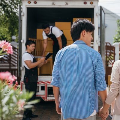 A couple by a moving van