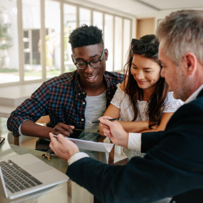 A group of people discussing the pros and cons of a FHA Loan