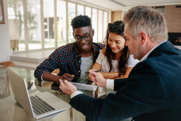 A group of people discussing the pros and cons of a FHA Loan